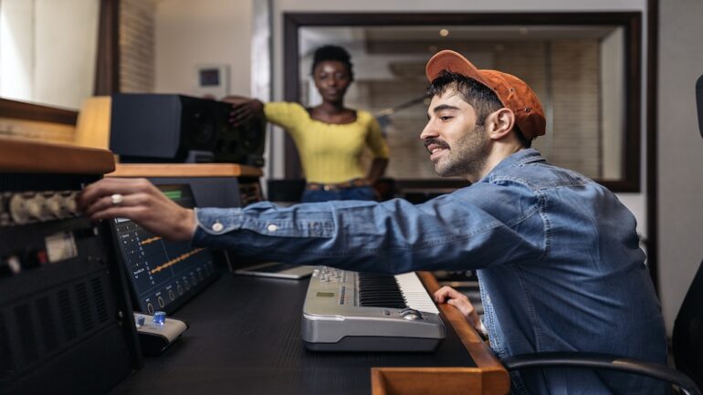men playing musical keyboard